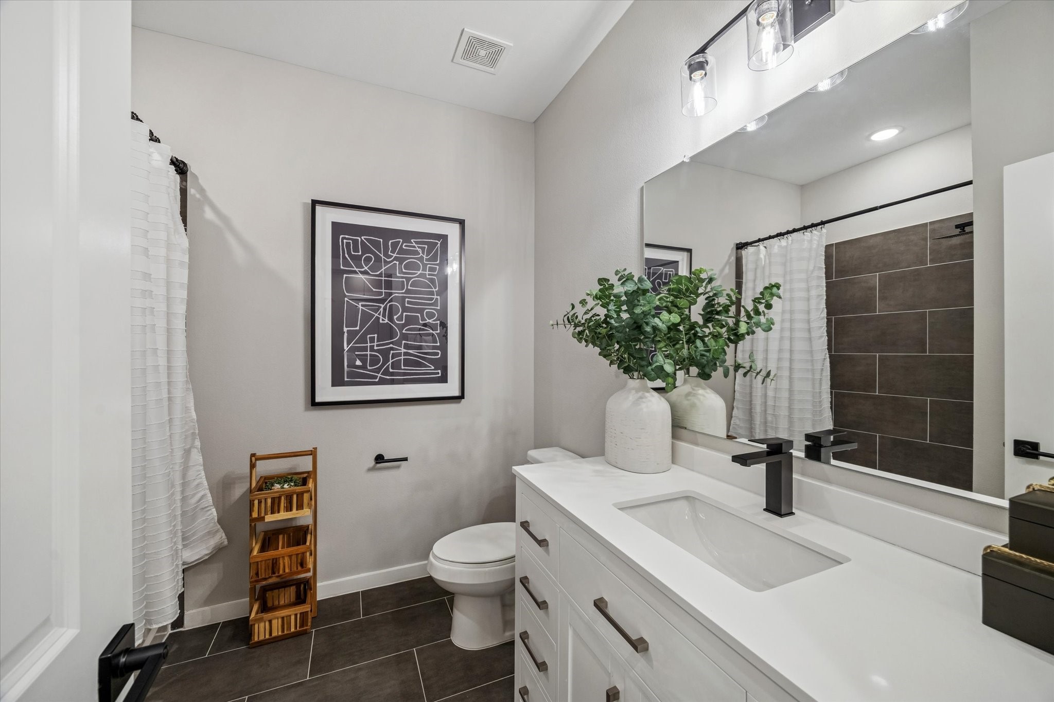 11327 Stonework Grove Lane Houston, TX 77076 - Photo 30 of 37 a bathroom with a sink toilet and shower