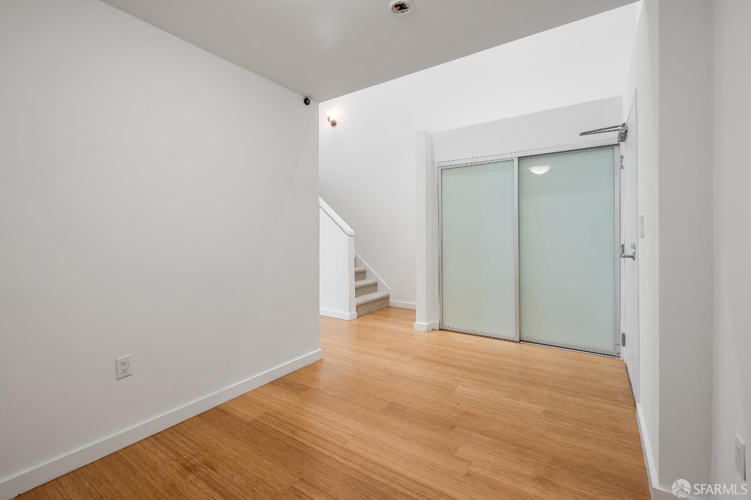 Harrison Street San Francisco, CA 94110 - Photo 12 of 26 a view of empty room with wooden floor