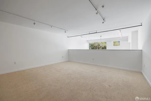 a bedroom with a bed and a table