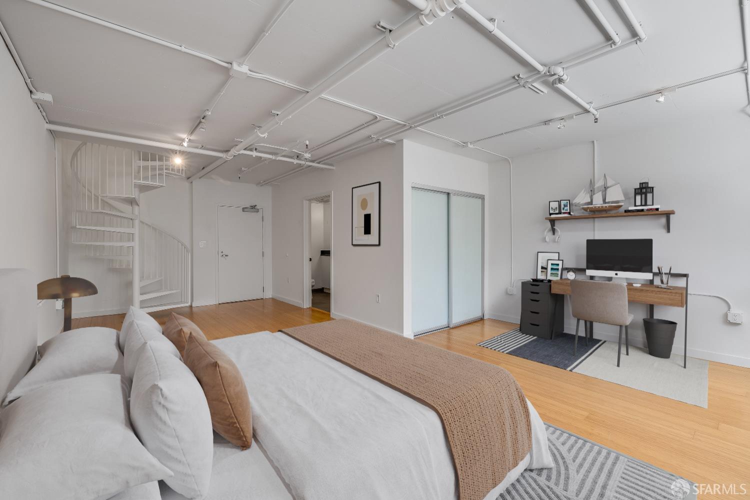 Harrison Street San Francisco, CA 94110 - Photo 17 of 26 a bedroom with a bed and a table