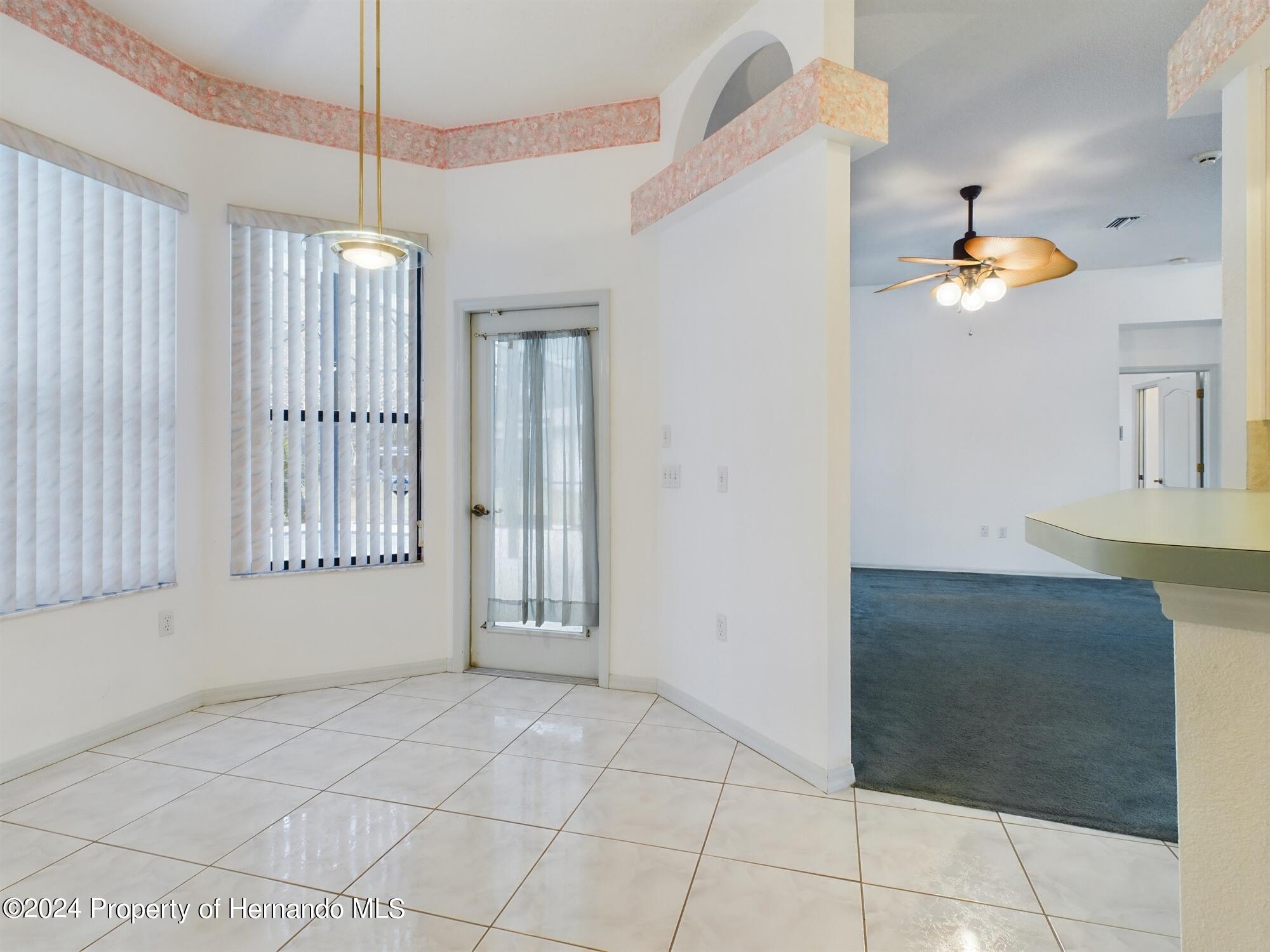 9198 Elida Road Spring Hill, FL 34608 - Photo 15 of 40 a view of an entryway with front door