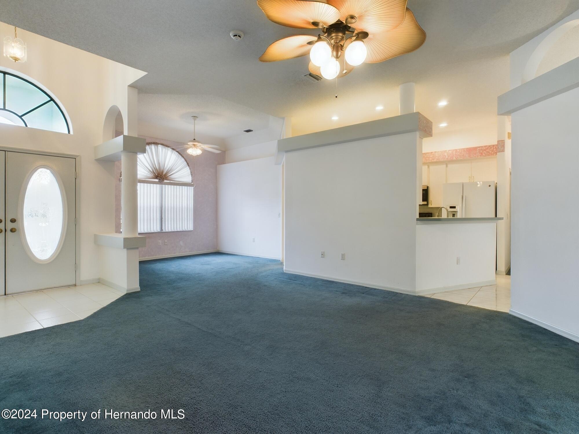 9198 Elida Road Spring Hill, FL 34608 - Photo 20 of 40 a view of a kitchen with a dishwasher and a fireplace