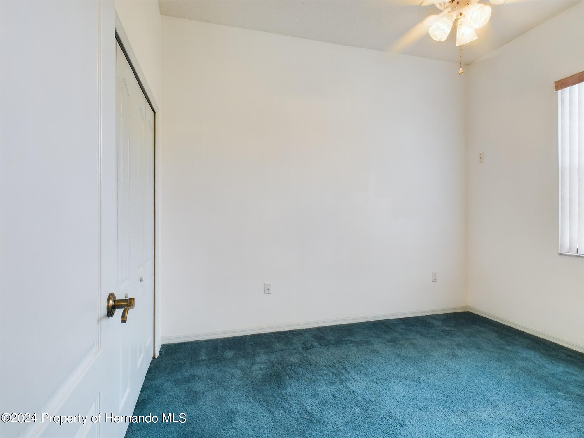 9198 Elida Road Spring Hill, FL 34608 - Photo 22 of 40 an empty room with a workbench