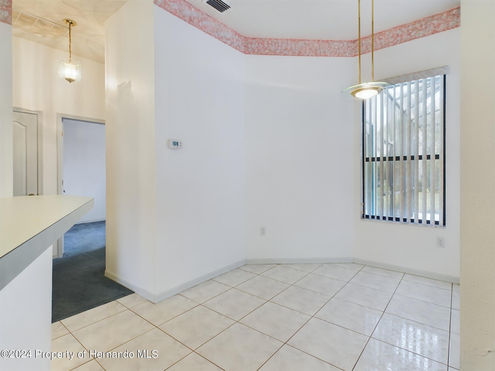 9198 Elida Road Spring Hill, FL 34608 - Photo 23 of 40 a view of a room with an empty space