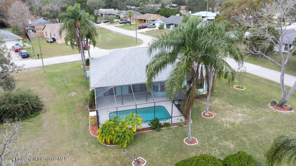 9198 Elida Road Spring Hill, FL 34608 - Photo 34 of 40 an aerial view of a house with garden space and street view