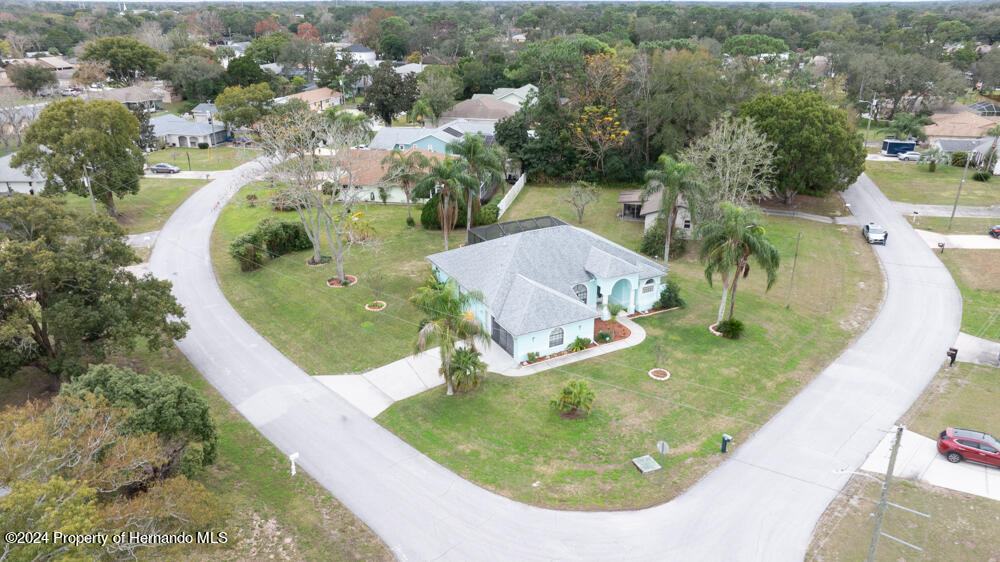 9198 Elida Road Spring Hill, FL 34608 - Photo 38 of 40 an aerial view of a swimming pool