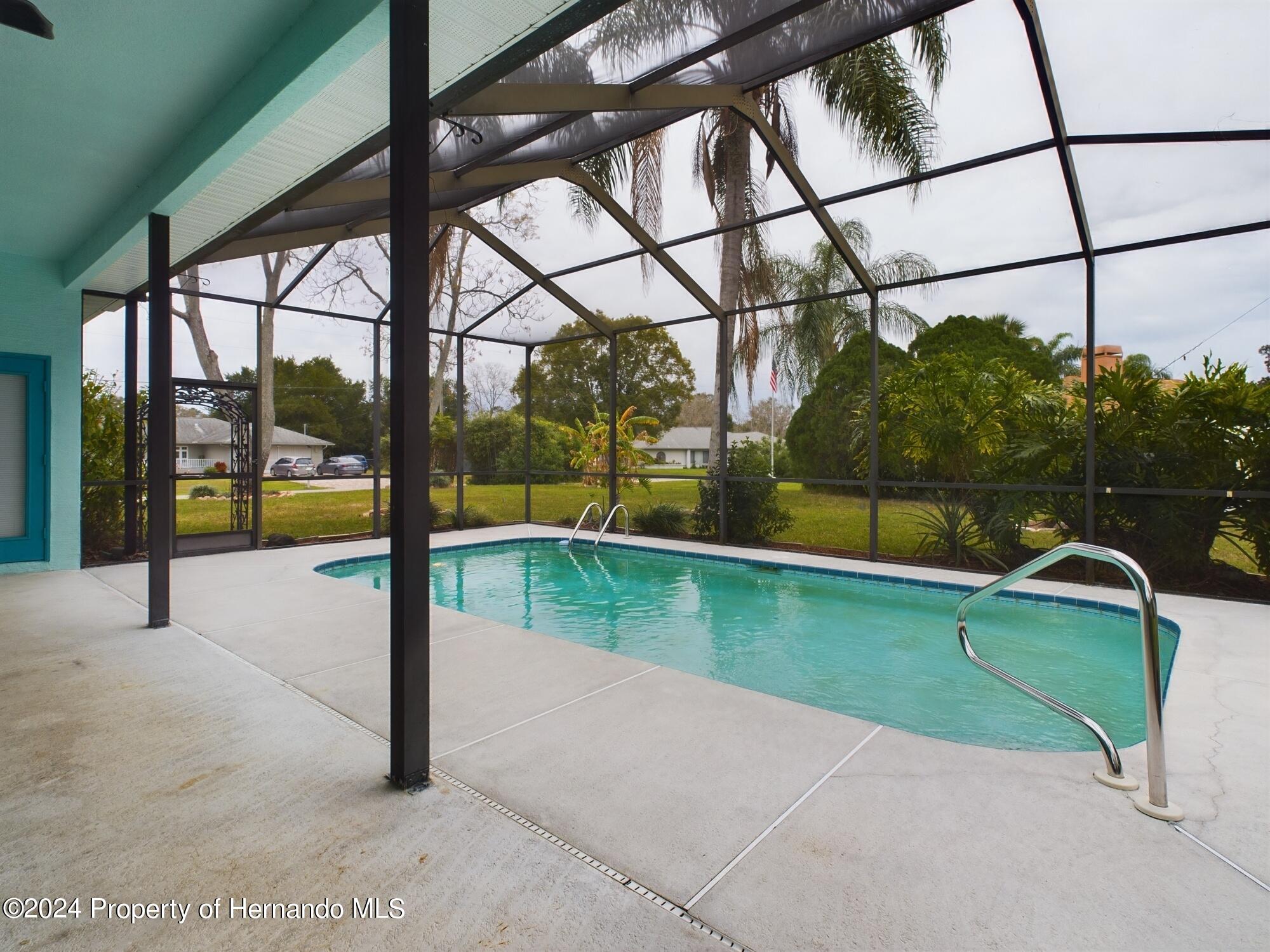 9198 Elida Road Spring Hill, FL 34608 - Photo 4 of 40 a view of a park with a slide