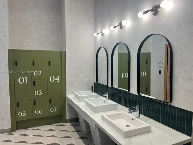 a bathroom with a double vanity sink and a mirror
