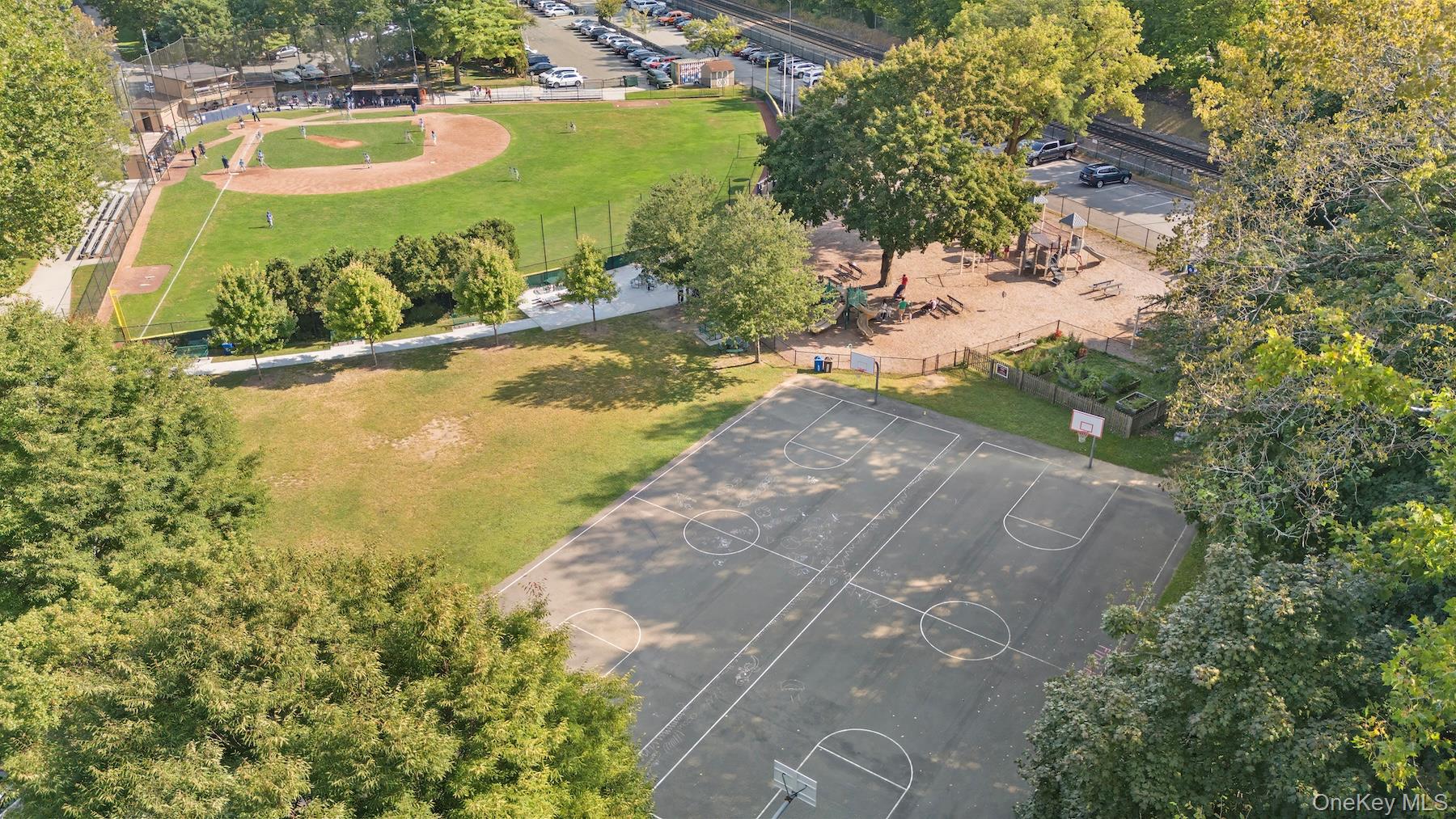235 Garth Road, Unit E2A Scarsdale, NY 10583 - Photo 34 of 37 a view of a lake with a yard