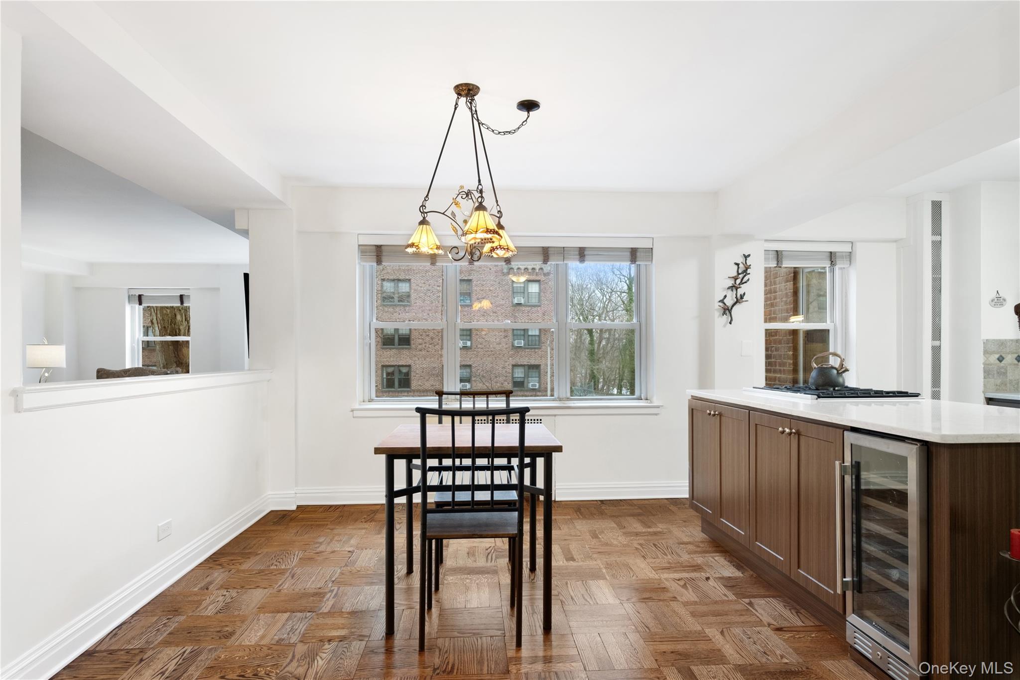 235 Garth Road, Unit E2A Scarsdale, NY 10583 - Photo 8 of 37 a view of a dining room with furniture
