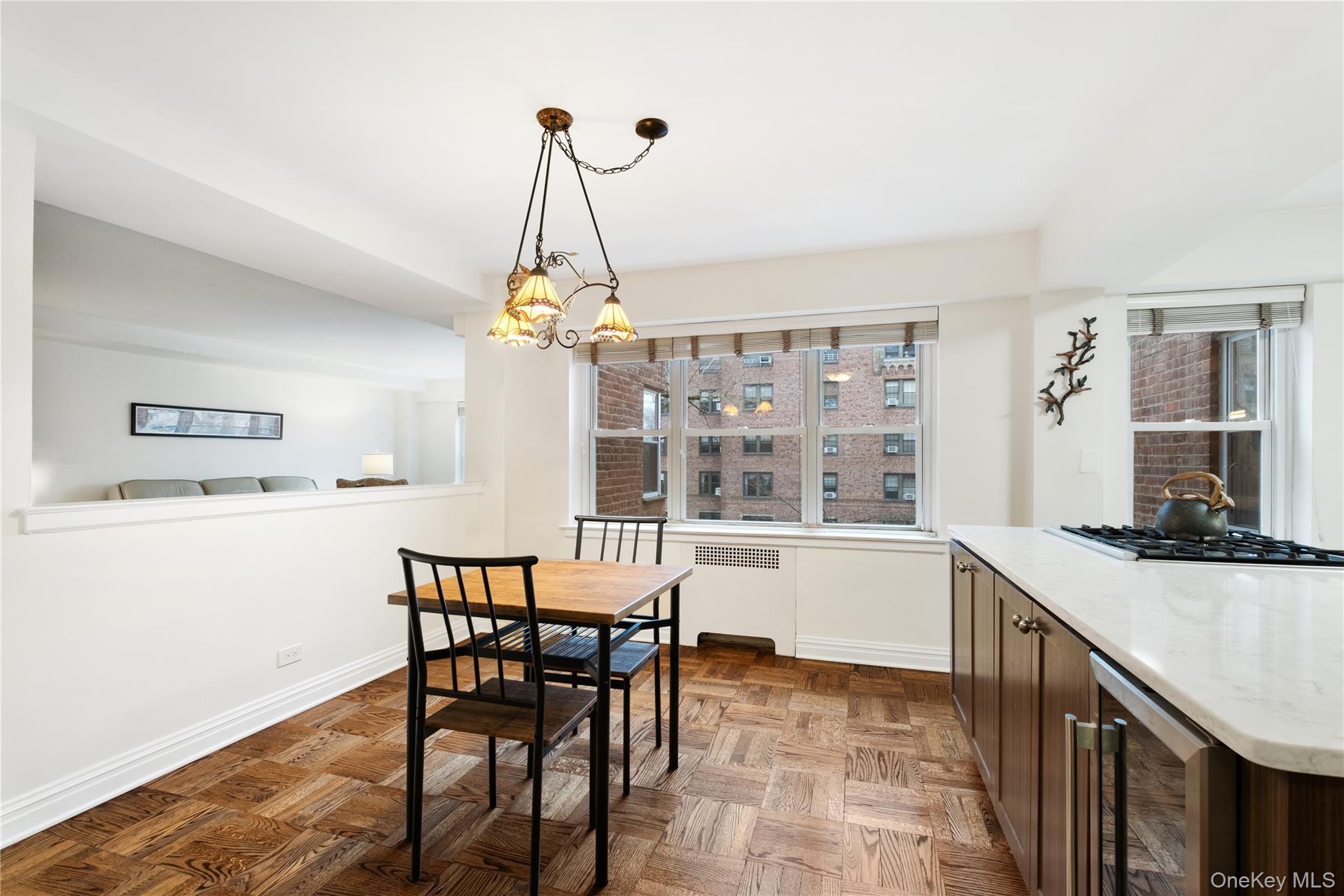 235 Garth Road, Unit E2A Scarsdale, NY 10583 - Photo 9 of 37 a view of a dining room with furniture window and wooden floor