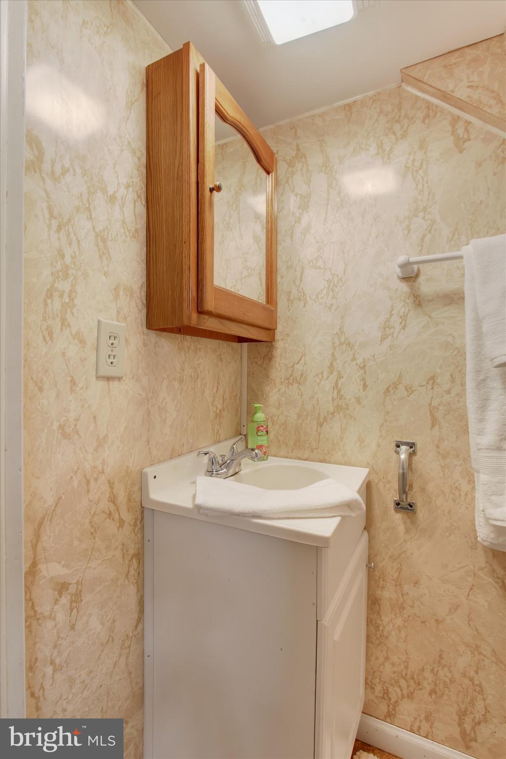 130 Spigot Valley Road Biglerville, PA 17307 - Photo 16 of 64 a bathroom with a sink a mirror and a shower