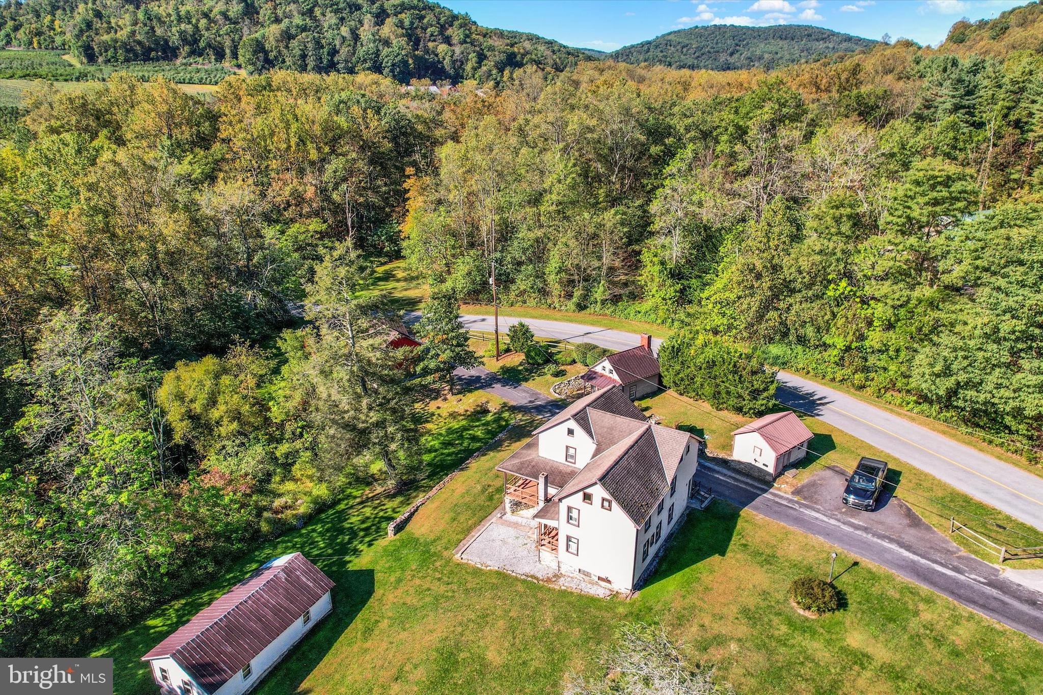 130 Spigot Valley Road Biglerville, PA 17307 - Photo 47 of 64 an aerial view of a house with a yard and lake view
