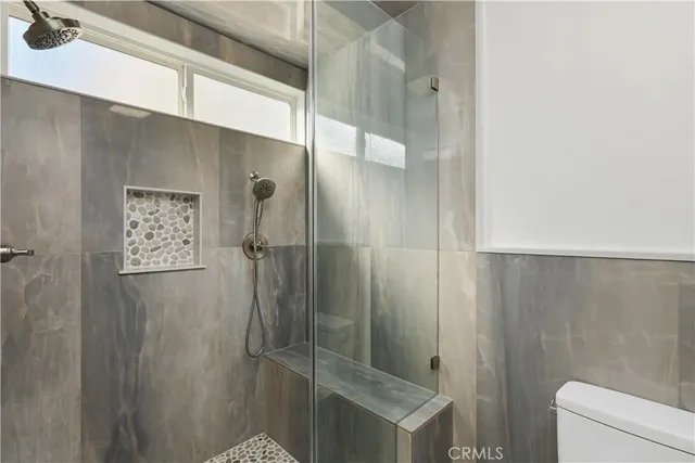 a bathroom with a shower and a sink