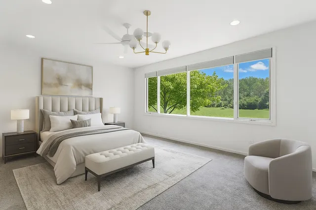a kitchen with granite countertop white cabinets and stainless steel appliances
