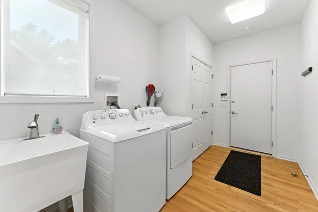 a view of a bench in the garden near a lake