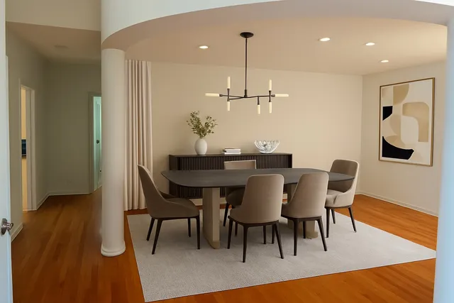 an empty room with a window and a ceiling fan