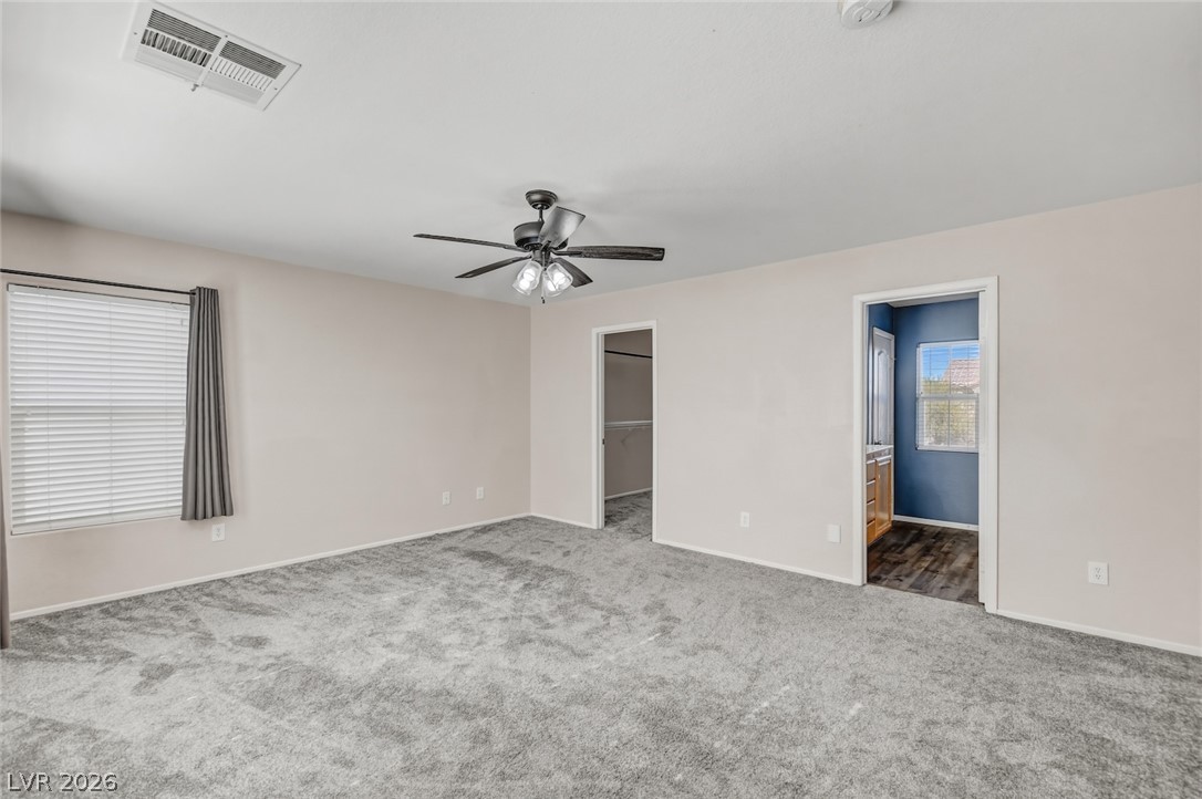 11159 Ranch Valley Street Las Vegas, NV 89179 - Photo 14 of 27 Comfortable carpeted space with a ceiling fan, offering a private retreat.