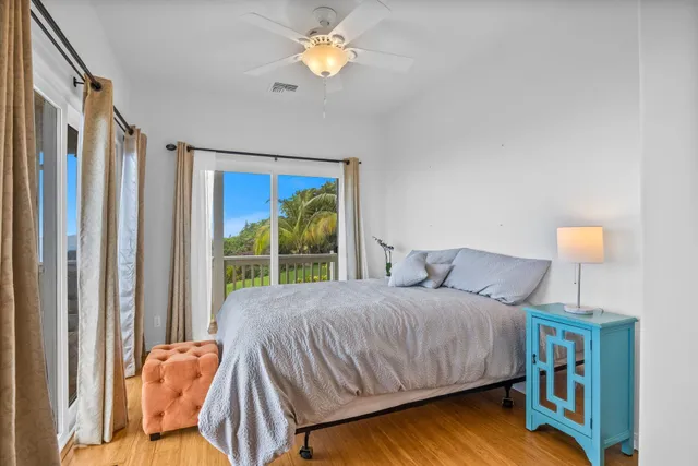 a bathroom with a toilet a sink and glass windows