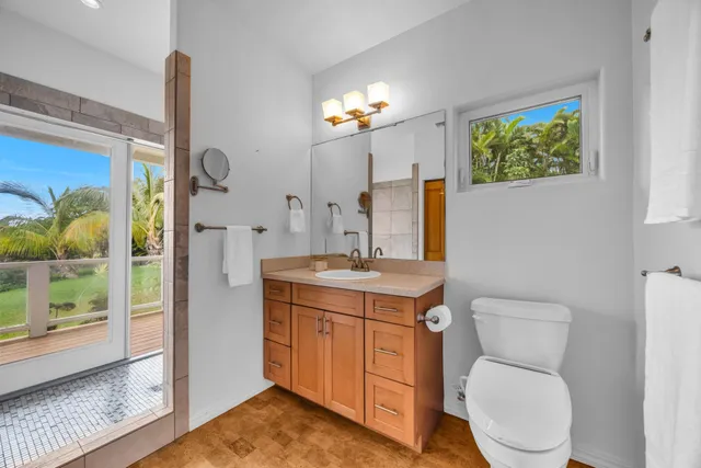 a bathroom with a glass shower door