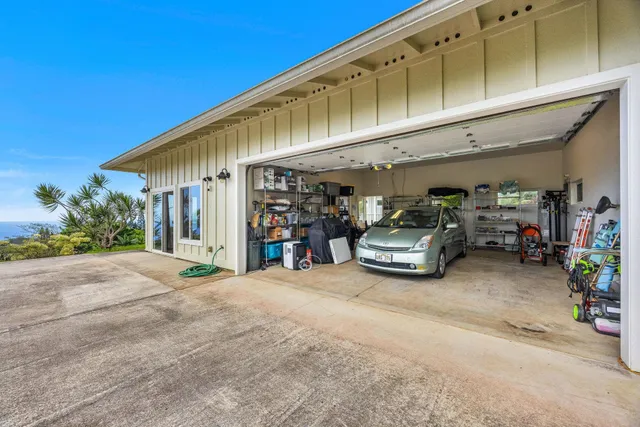 a living room with furniture and large windows