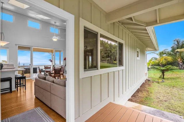 a view of living room kitchen with furniture and wooden floor