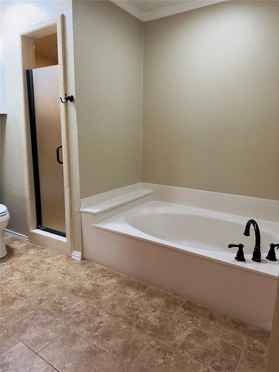 3929 St Christopher Lane Dallas, TX 75287 - Photo 16 of 22 a bathroom with a bathtub and shower