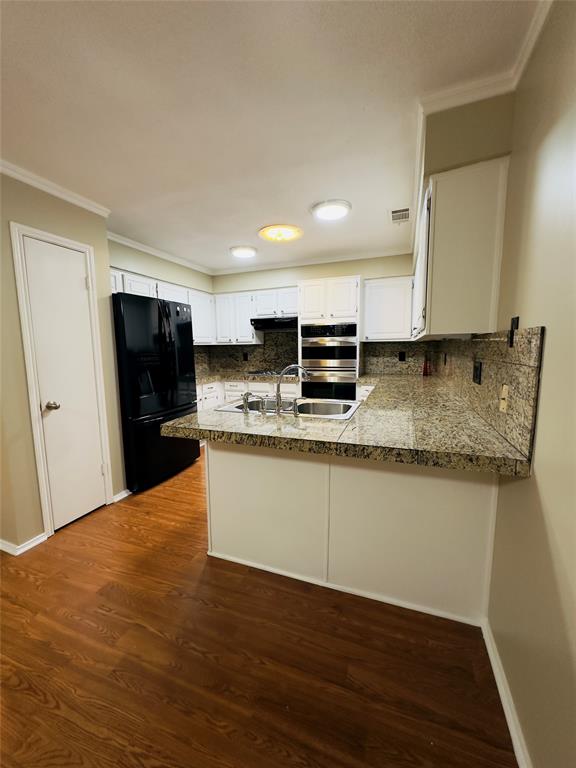 3929 St Christopher Lane Dallas, TX 75287 - Photo 19 of 22 a large kitchen with granite countertop a sink a counter space and cabinets