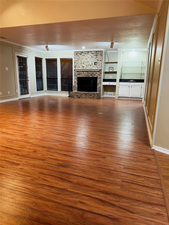 3929 St Christopher Lane Dallas, TX 75287 - Photo 2 of 22 a view of a living room with furniture and fireplace