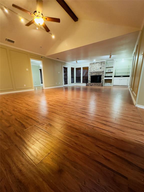 3929 St Christopher Lane Dallas, TX 75287 - Photo 3 of 22 an empty room with wooden floor and fan