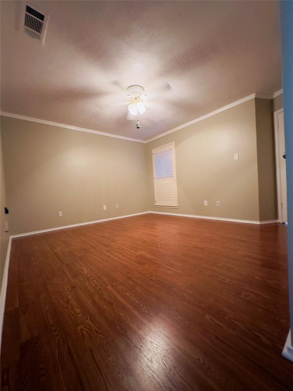 3929 St Christopher Lane Dallas, TX 75287 - Photo 6 of 22 an empty room with wooden floor and windows