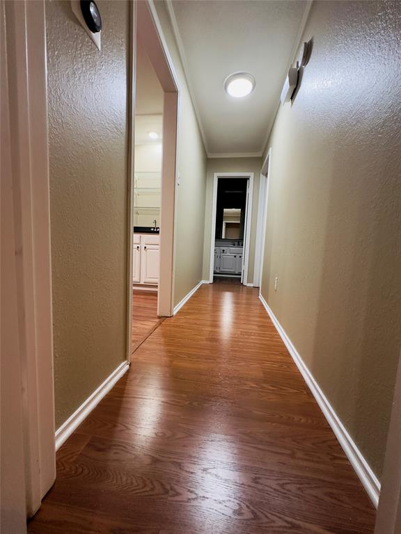 3929 St Christopher Lane Dallas, TX 75287 - Photo 7 of 22 a view of hallway with wooden floor
