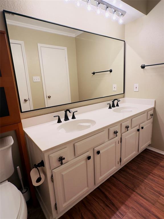 3929 St Christopher Lane Dallas, TX 75287 - Photo 10 of 22 a bathroom with a double vanity sink and mirror