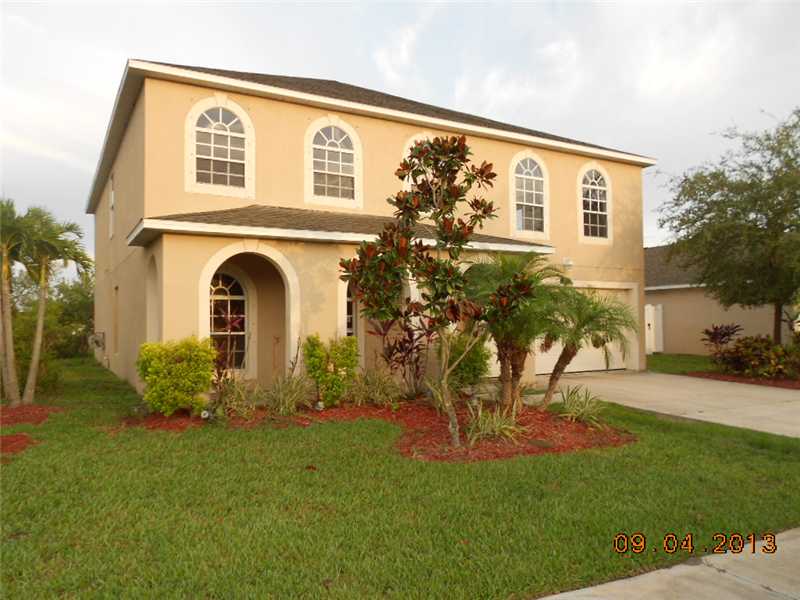 6044 Ridge Lake Circle Vero Beach, FL 32967 - Photo 1 of 14 a view of a house with a yard