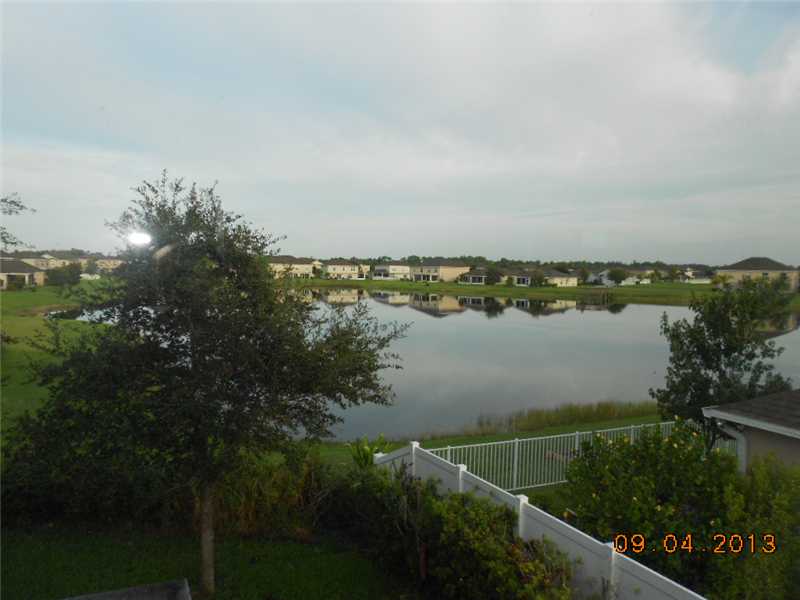 6044 Ridge Lake Circle Vero Beach, FL 32967 - Photo 3 of 14 a view of a lake with a city view