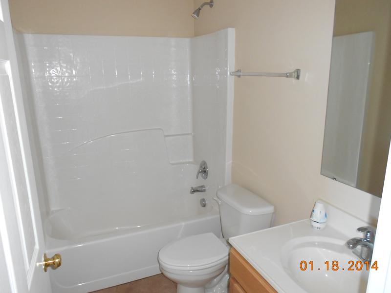 6044 Ridge Lake Circle Vero Beach, FL 32967 - Photo 10 of 14 a bathroom with a toilet and a shower