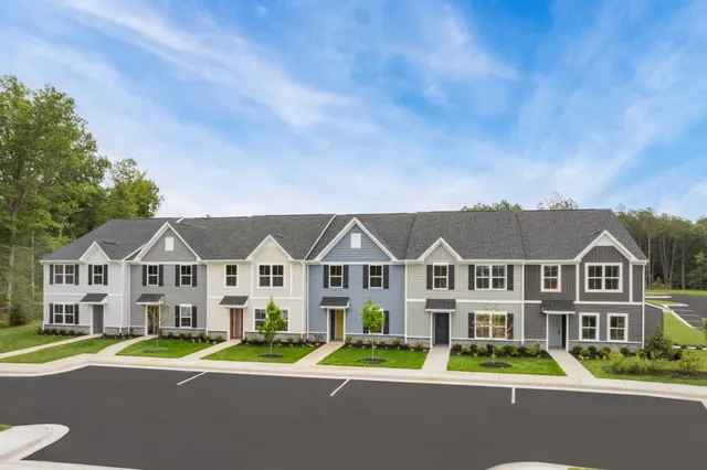 a view of residential houses with street view