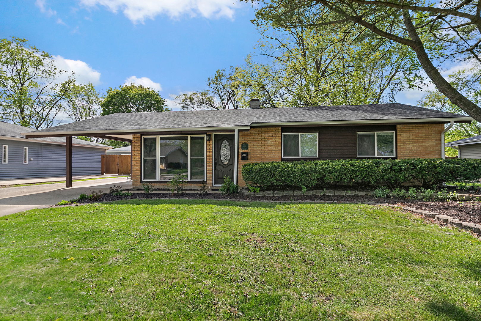 front view of a house with a yard