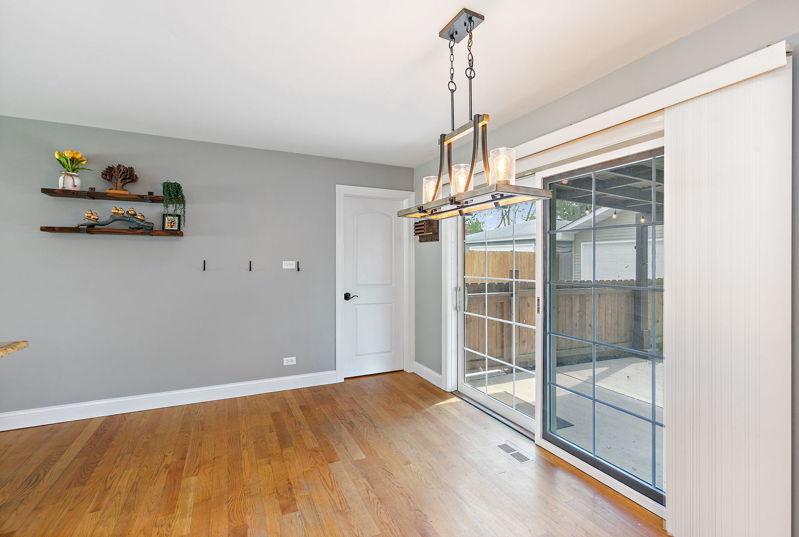 710 Olive Street Hoffman Estates, IL 60169 - Photo 11 of 30 a view of empty room with wooden floor and fan