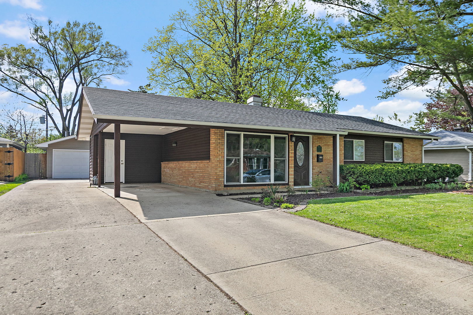 710 Olive Street Hoffman Estates, IL 60169 - Photo 2 of 30 a front view of a house with a yard and garage