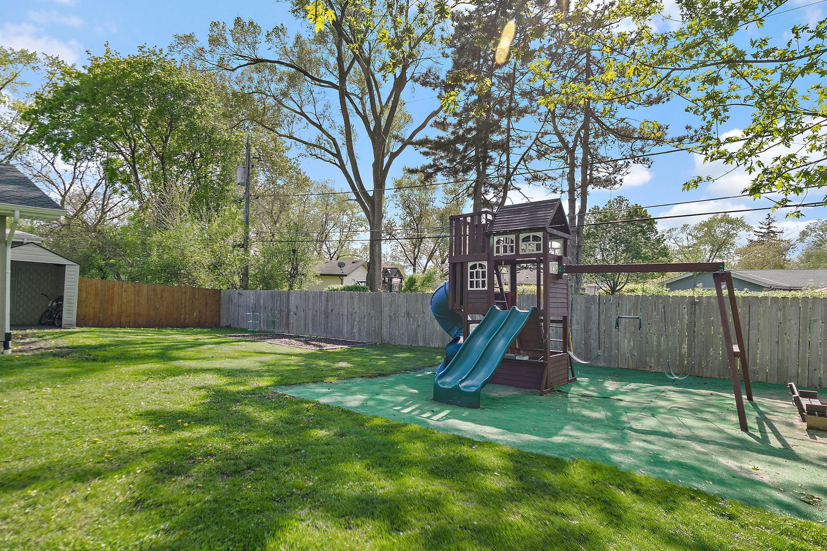 710 Olive Street Hoffman Estates, IL 60169 - Photo 24 of 30 a view of a backyard with a slide