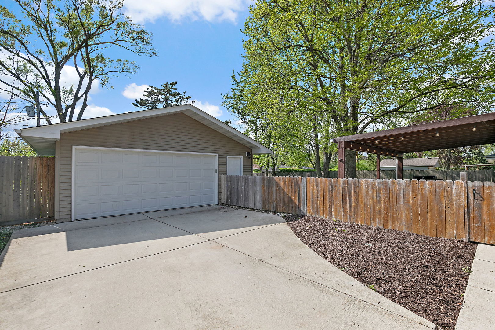 710 Olive Street Hoffman Estates, IL 60169 - Photo 25 of 30 a view of backyard with small cabin and wooden fence