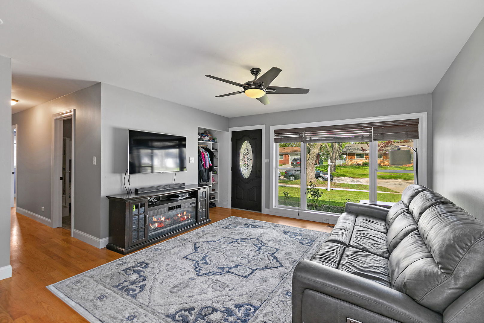 710 Olive Street Hoffman Estates, IL 60169 - Photo 4 of 30 a living room with furniture and a flat screen tv