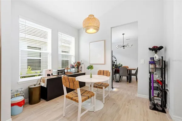 a view of a a dining room with furniture window and outside view