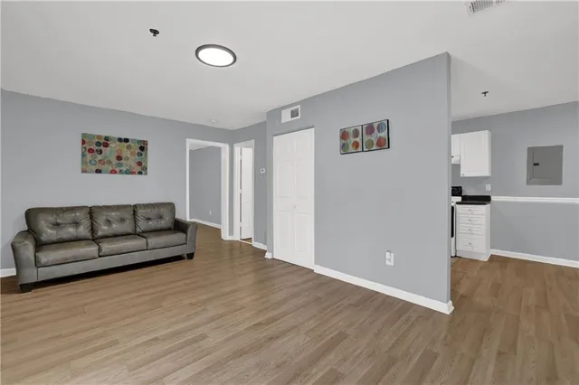 a view of a livingroom with furniture and wooden floor
