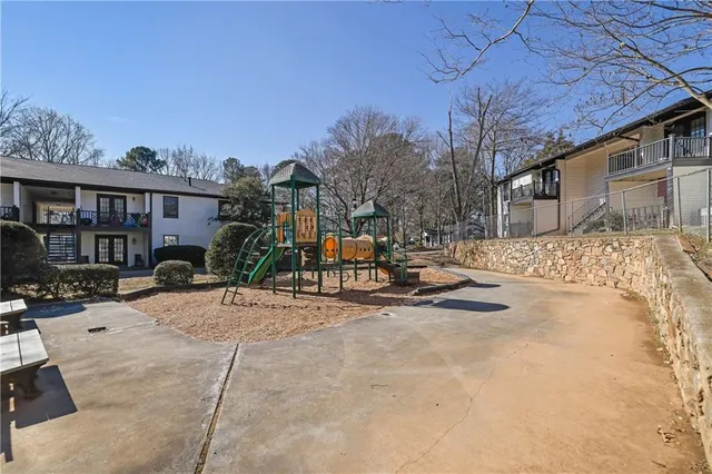 a view of a house with snow on the road