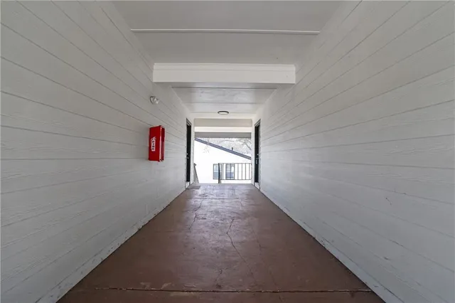 a view of a hallway with windows