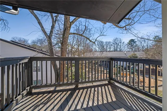 a view of balcony with wooden floor