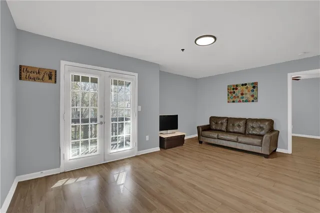 a view of workspace with wooden floor and furniture