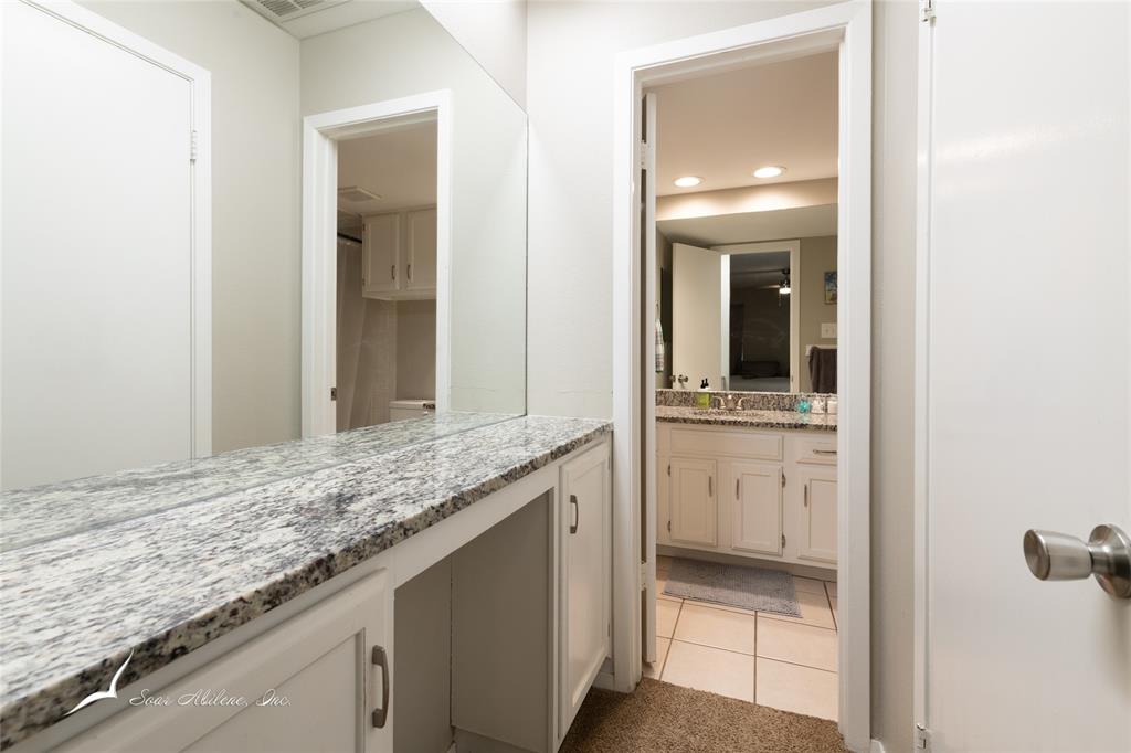 1318 Westheimer Road, Unit 217 Abilene, TX 79601 - Photo 13 of 16 a bathroom with a sink and a mirror